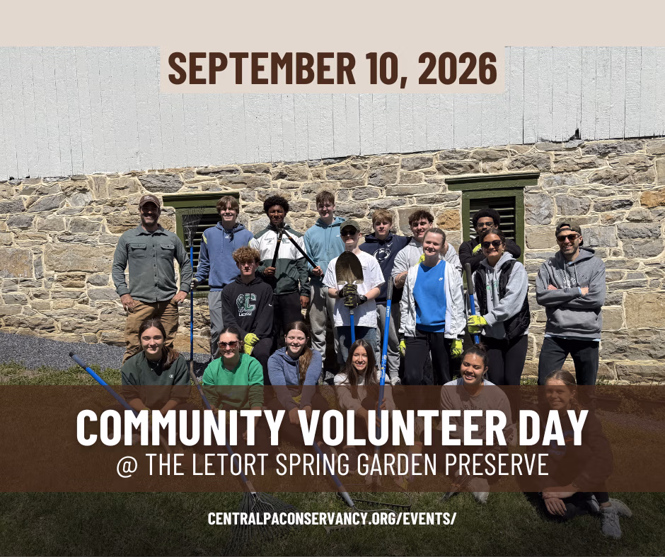 Group of volunteers posing in front of a stone wall for Community Volunteer Day at The Letort Spring Garden Preserve, Sept 10, 2026.